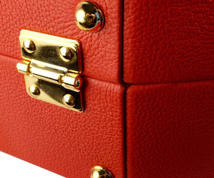 Valigia rossa in pelle Maison Luxure.